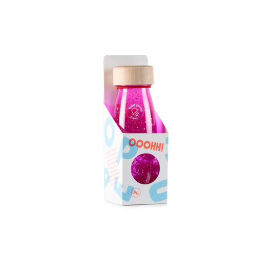 Botella sensorial rosa para bebé metida en su envase original